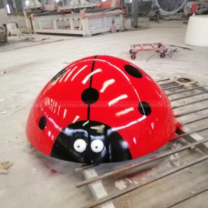 red ladybug lawn ornament
