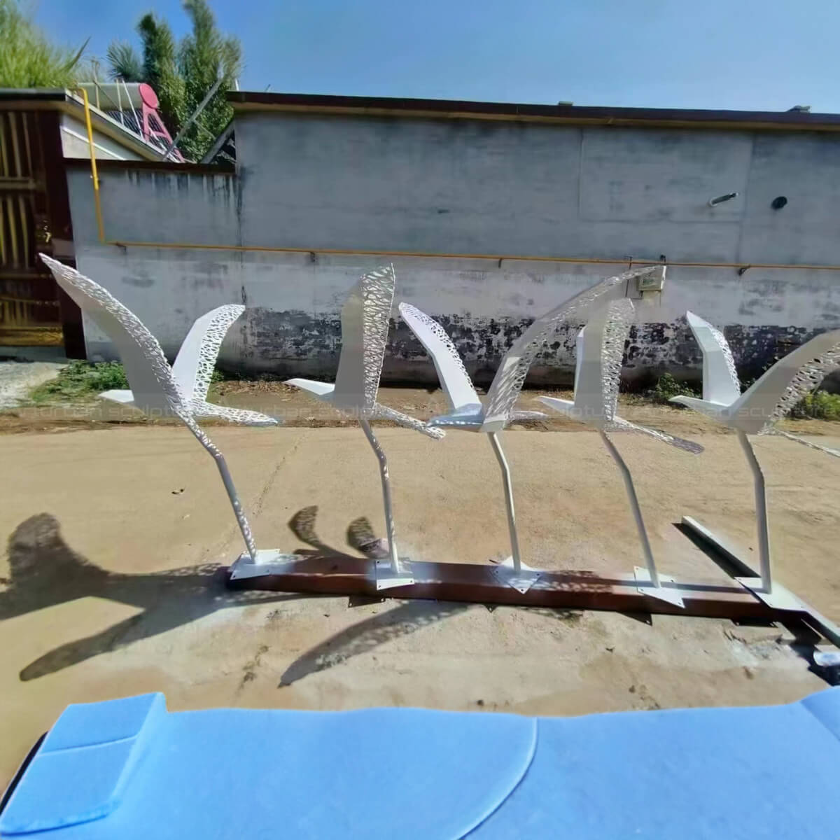 stainless steel birds in flight statue