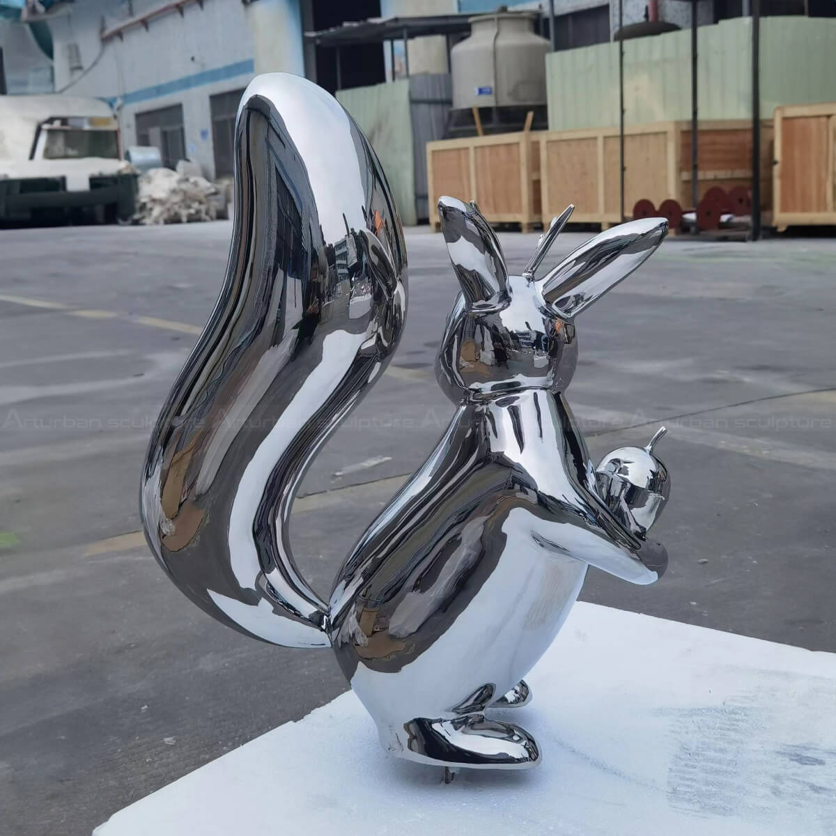 stainless steel squirrel with acorn yard statue