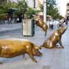 A Day Out bronze Sculpture showing four pigs