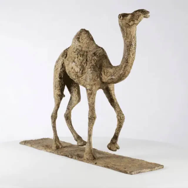 Bronze Camel elegantly walking with a slightly raised neck Figurine