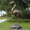 Bronze Flamingo Sculpture standing on rock with vivid detailed feathers