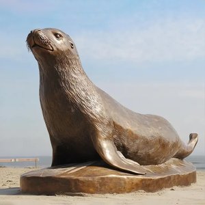 Bronze Sea Lion statue lying on the base