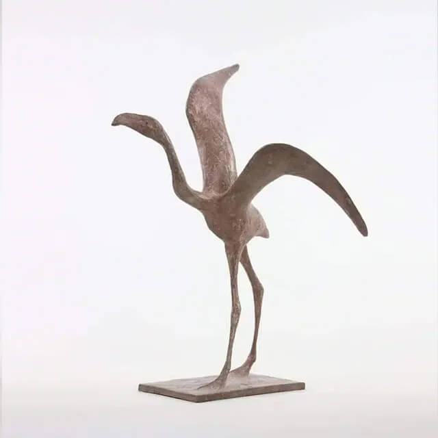 Contemporary flamingo Bird Figurine featuring elongated legs and outstretched wings