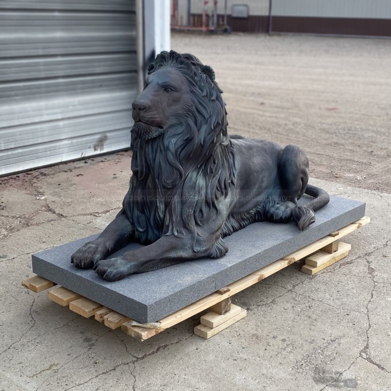 Guardian Lion bronze Statue for Sale resting on a stone pedestal