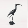Ibis Sculpture elegantly standing with its long curved beak and slender legs