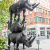 The Last Three Statue by Gillie and Marc Schattner featuring three stacked rhinoceroses, representing the last Northern White Rhinos