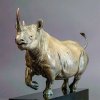 bronze Black Rhino Sculpture by Nick Bibby, depicting the animal in a dynamic running pose with detailed muscle lines