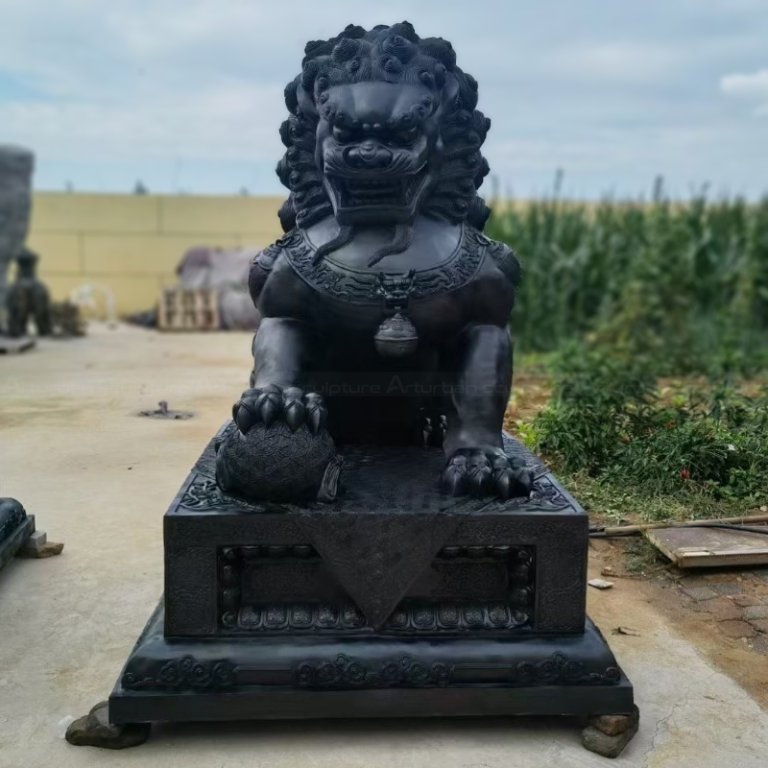 bronze Chinese Lion Dog Ornaments placing its right paw on an embroidered ball