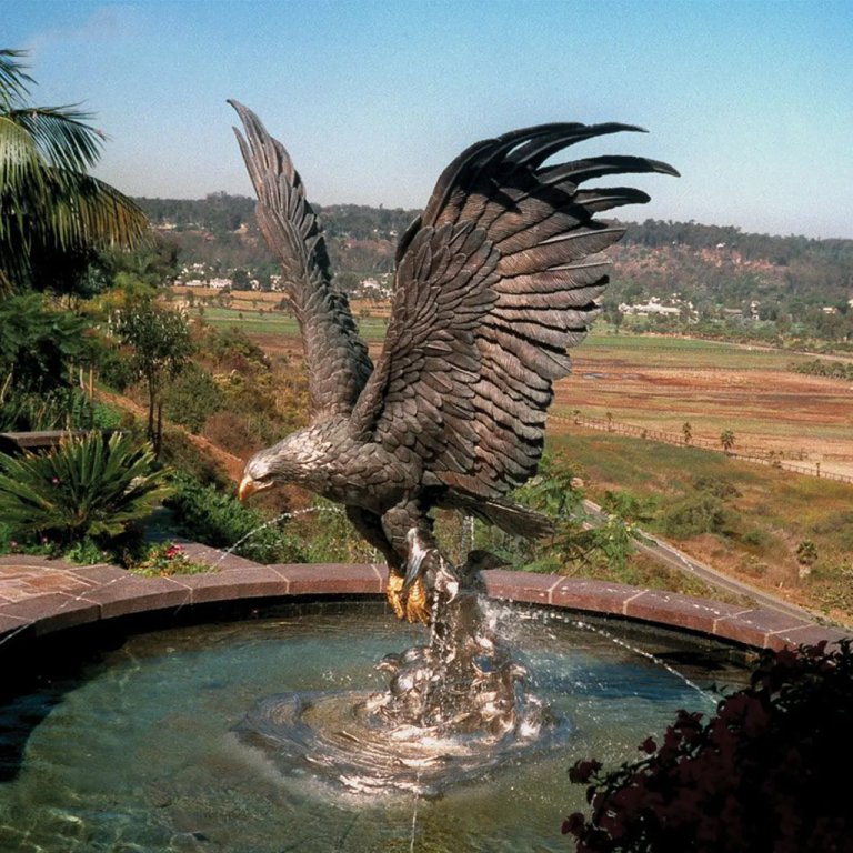 bronze Eagle Water Fountain statue preparing to catch prey, with wings spread wide