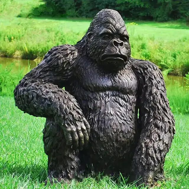 bronze Sitting Gorilla Statue with a stern expression
