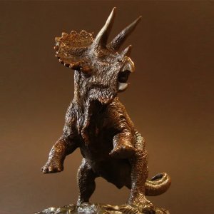 front view of bronze Triceratops Sculpture in a battle-ready stance,