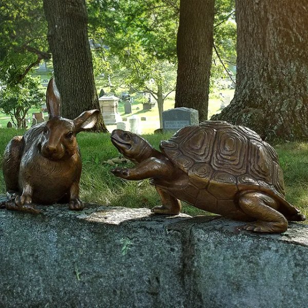 rabbit and a tortoise interacting statue