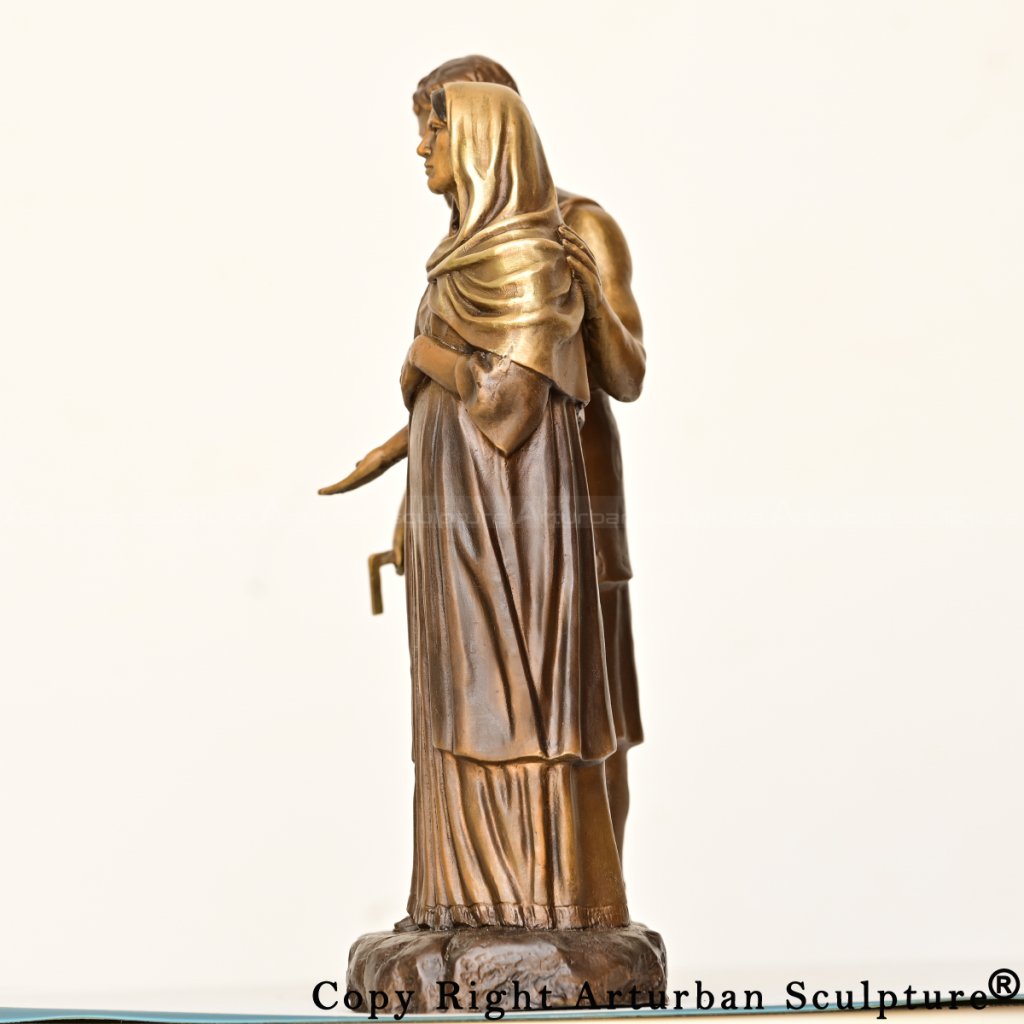 side view of pregnant mary bronze statue