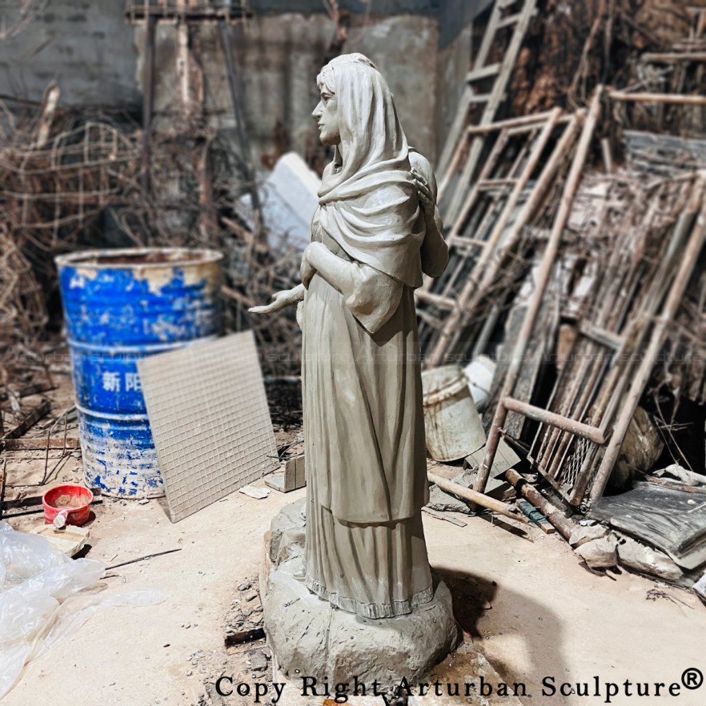 clay mold of pregnant mary statue side veiw