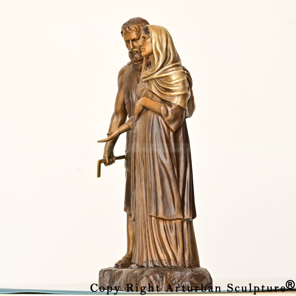 mary and joseph statue showing joseph gently hold pregnant mary
