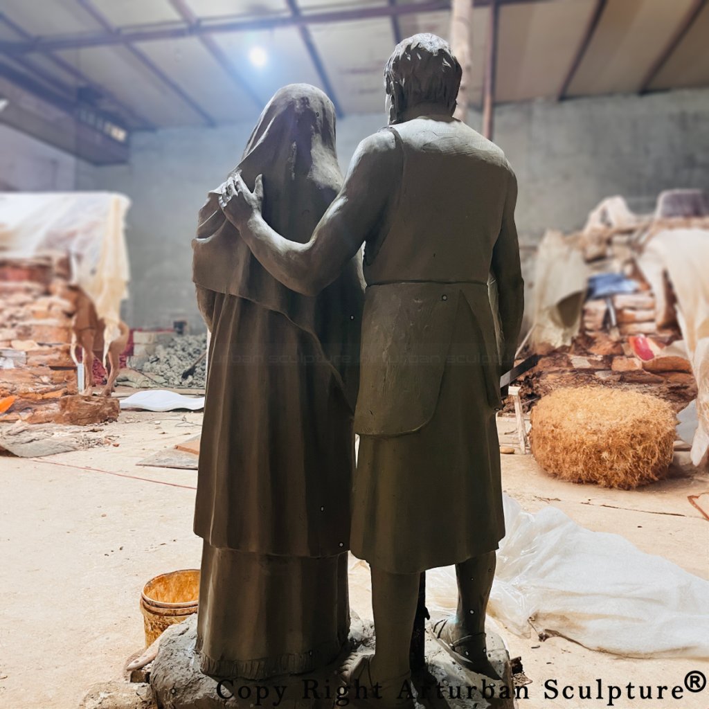 rear view of clay mold of mary and joseph statue