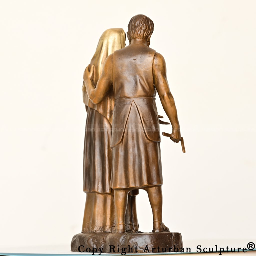 mary and joseph statue showing joseph gently holding mary