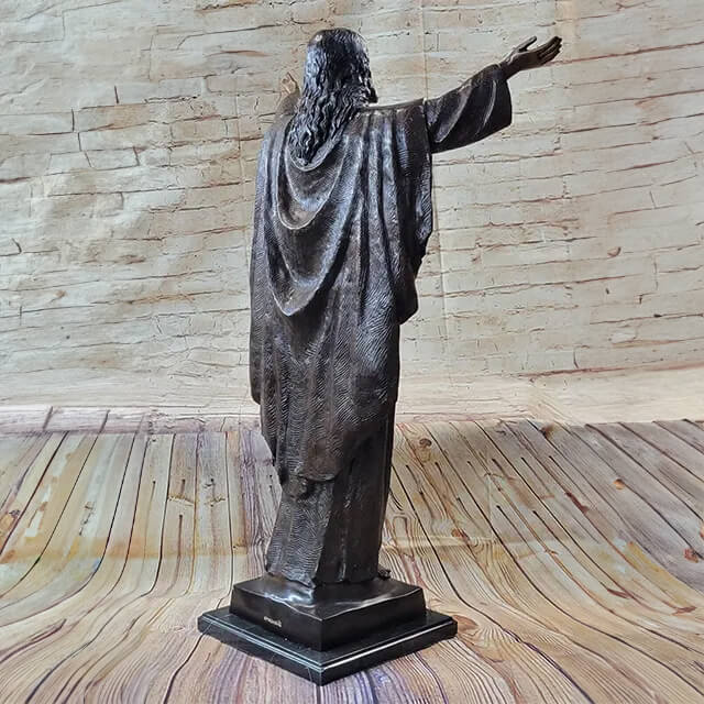 Bronze Statue of Jesus, showcasing flowing robes and outstretched right arm