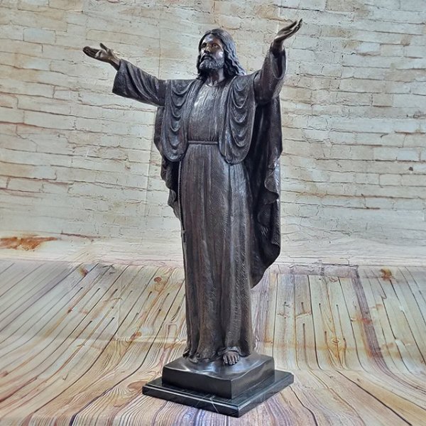 Bronze Statue of Jesus standing barefoot on a square base