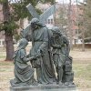 Bronze Way of the Cross Statue depicting Jesus holding Veronica’s veil as a Roman soldier stands beside him