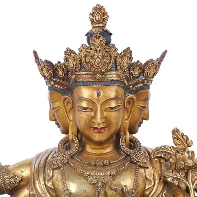 Close-up of the crowned Tibetan Bronze Buddha Statue depicting Avalokiteshvara with four serene faces and detailed ornaments