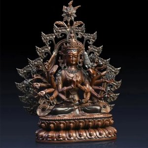 Frontal view of a bronze Thousand Armed Avalokiteshvara Statue seated on a lotus base