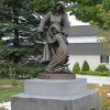 Full view of a bronze Visitation Statue depicting the biblical encounter between Mary and Elizabeth
