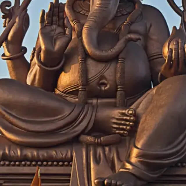 Lower detail of a bronze Lord Ganesha Sculpture showing gesture mudras, rounded belly