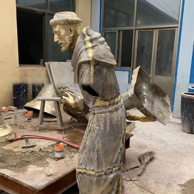 Partially assembled St Francis Assisi Garden Statue in a workshop