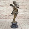 Playful Bronze Cherub Sculpture featuring a barefoot cherub holding a flower