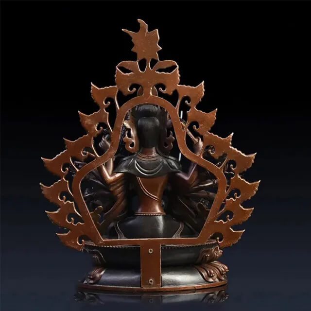Rear view of a bronze Thousand Armed Avalokiteshvara Statue showing layered arms and ornamental flame-shaped aureole