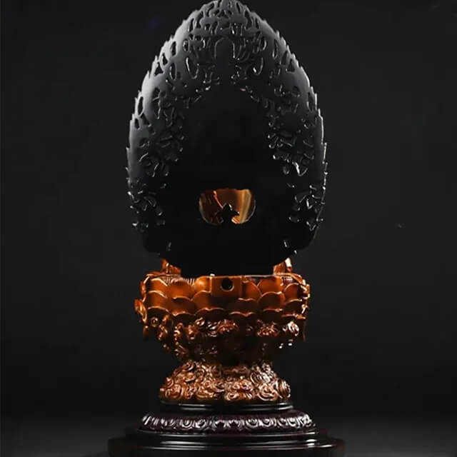 Rear view of the bronze Vairocana Statue with engraved motifs and the lotus base structure
