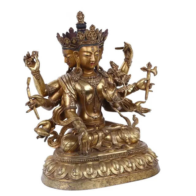 Close-up of the crowned Tibetan Bronze Buddha Statue depicting Avalokiteshvara with four serene faces and detailed ornaments