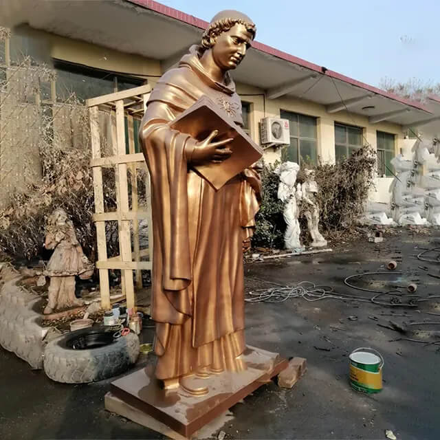 bronze St. Thomas Aquinas Aquinas Statue with serene expression