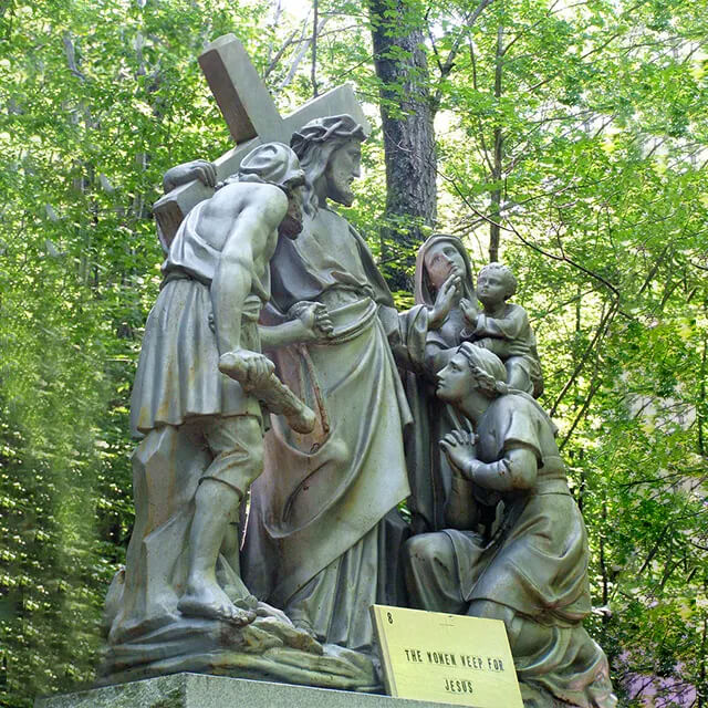 bronze Way of the Cross Statue showing Jesus carrying the cross while comforting weeping women and children