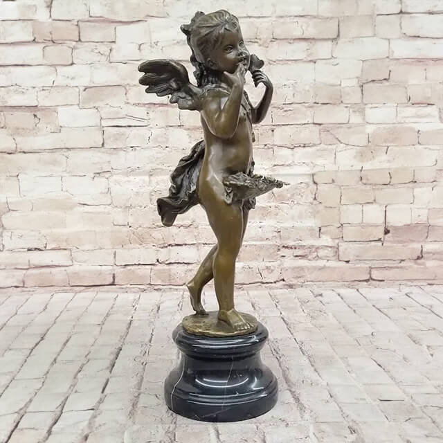 side view of a Bronze Cherub Sculpture, with the cherub holding a flower