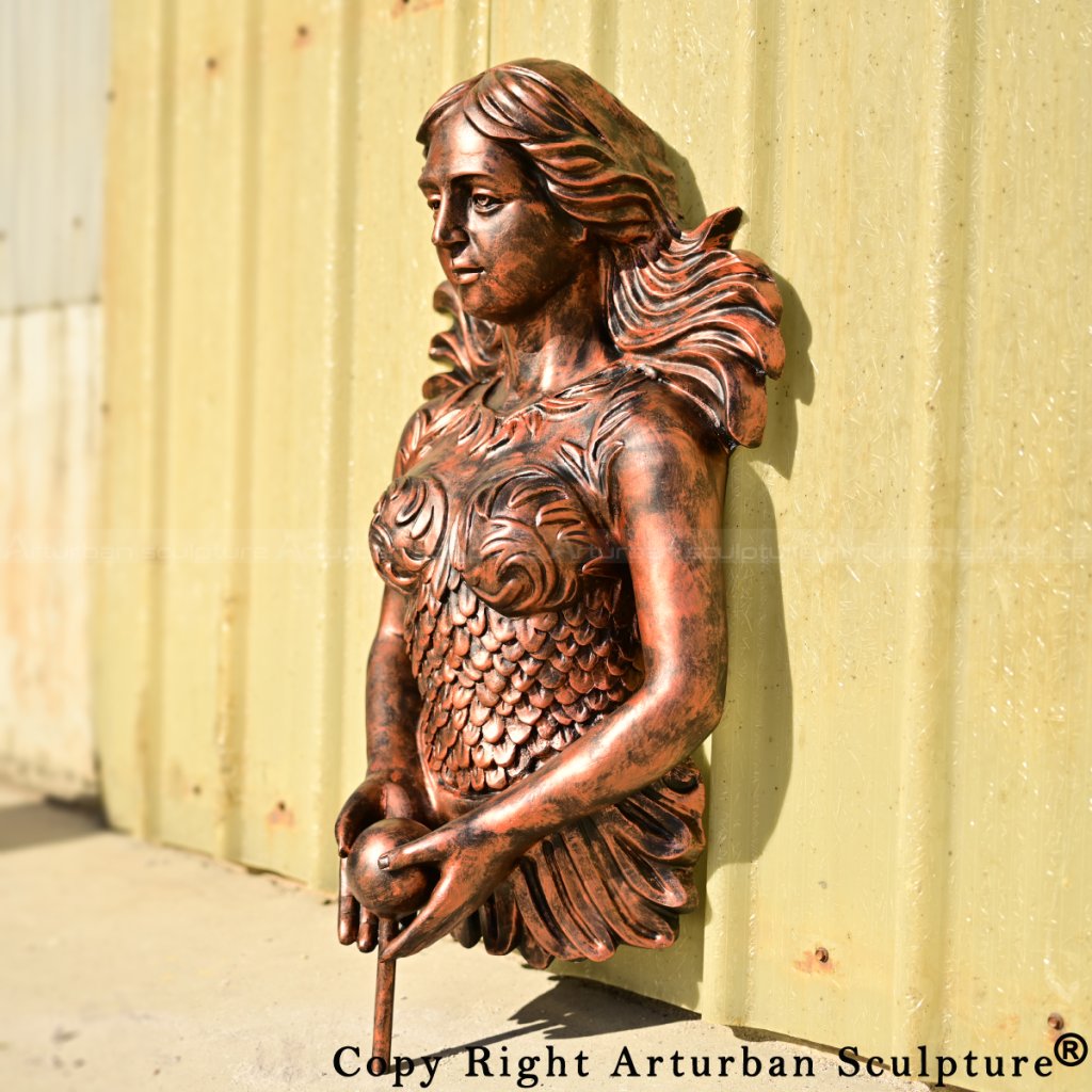 Side angle of Mermaid Bronze wall fountain showing elegant posture