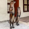 A pair of bronze Otter Lawn Ornaments of river otters