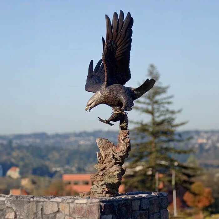 Bronze Bald Eagle Outdoor Décor with wings raised and talons extended, ready to dive