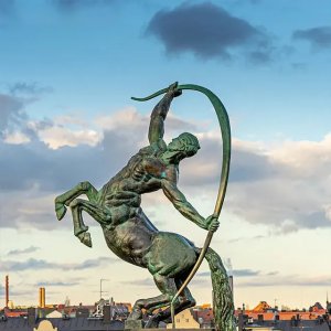 Bronze Centaur Garden Statue showing a muscular centaur rearing up with a raised bow