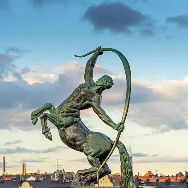 Bronze Centaur Garden Statue showing a muscular centaur rearing up with a raised bow