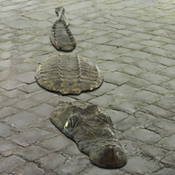 Bronze Crocodile Statue by Rip Caswell, segmented into head, back, and tail parts