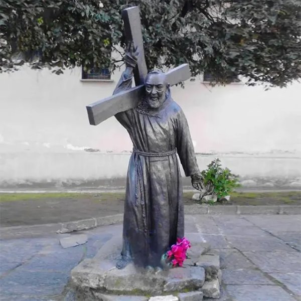 Bronze Padre Pio Garden Statue showing Saint Pio wearing a Franciscan robe and carrying a large cross