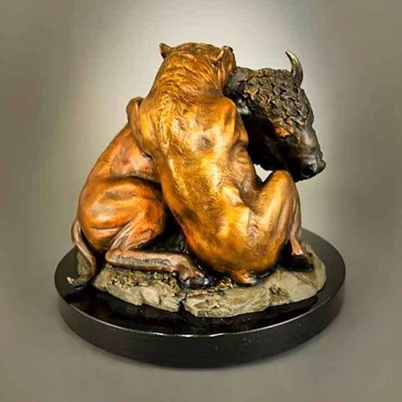 Bull and Bear Bronze Statue showing a bear gripping a bison from behind