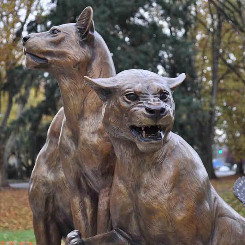 Close-up of bronze Lionesses Statue showing one roaring, and one facing forward in tribute composition