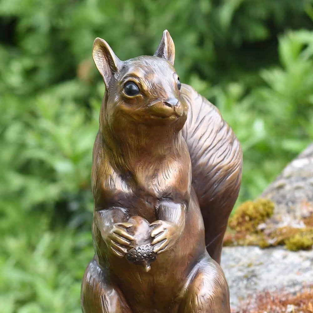 Close-up of bronze Outdoor Squirrel Statue with detailed fur and natural expression