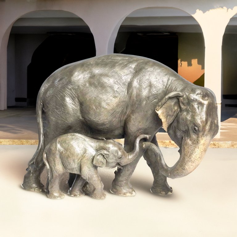 Elephant statues for yard featuring a bronze Asian elephant mother and calf walking together
