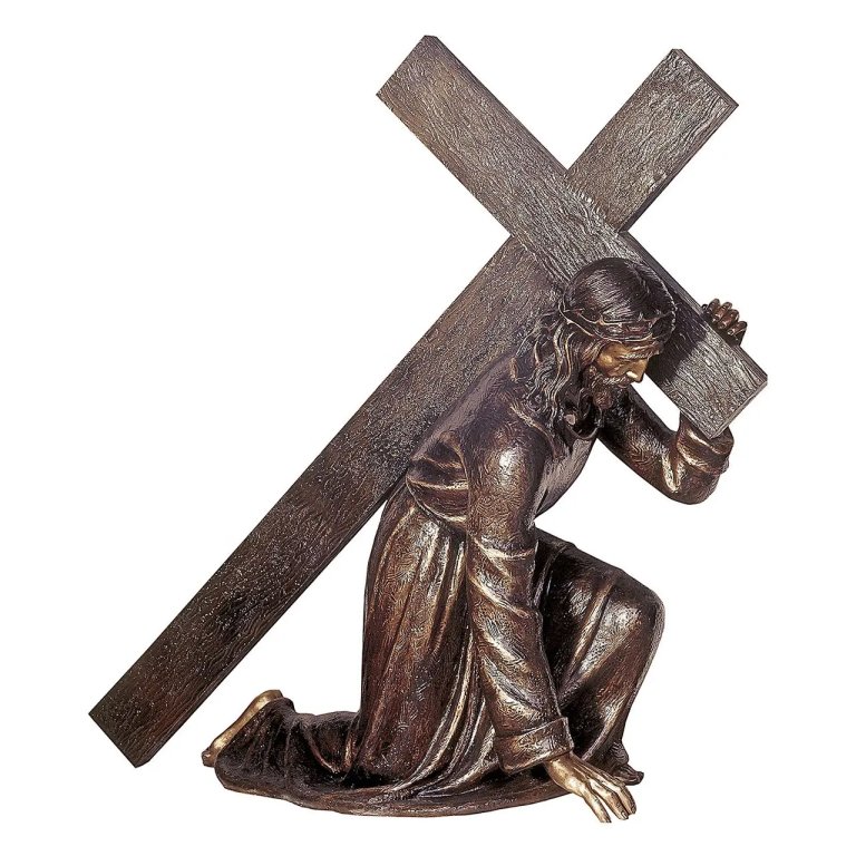 Jesus Carrying Cross Sculpture featuring a realistic bronze finish, depicting Christ kneeling with a large cross on his shoulder