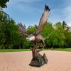 Lifelike bronze Bald Eagle Outdoor Décor sculpture in dynamic landing pose